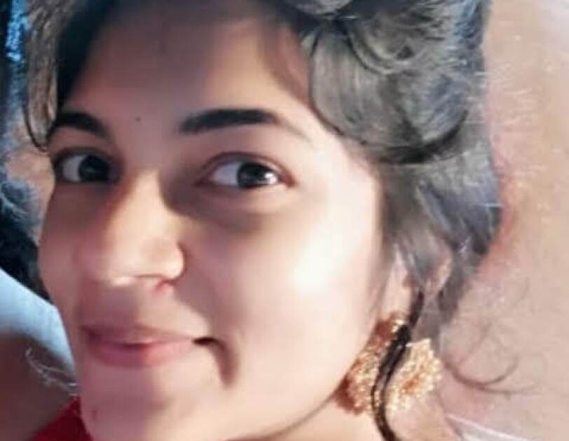 This is a close up pic of Sonu smiling into the camera wearing an Indian attire