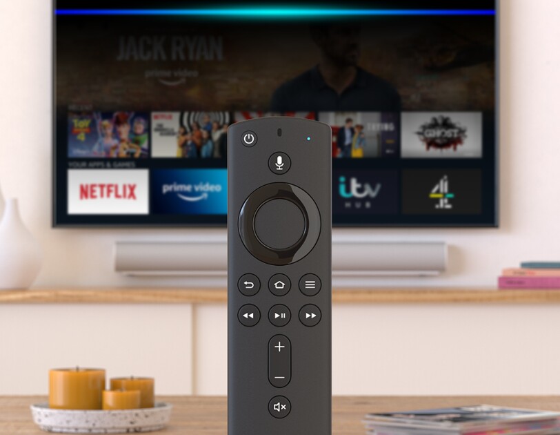 Fire TV remote in front of a television.