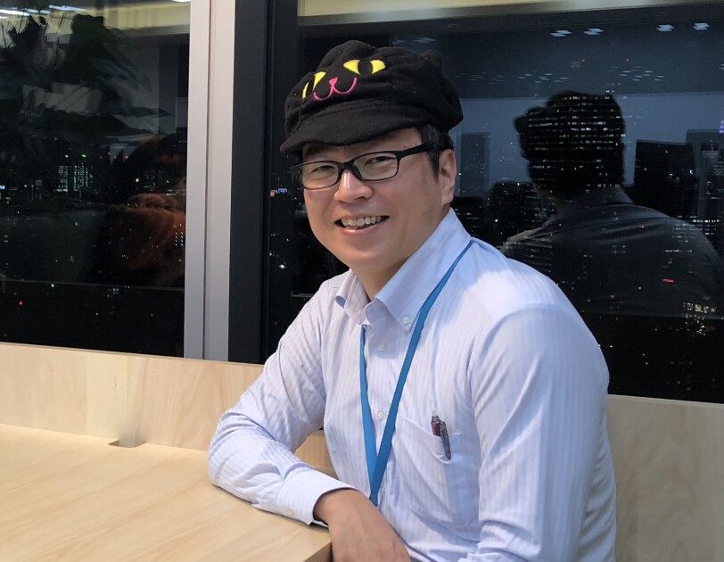 Noboru Obata, a Senior Account Manager on the Amazon Prime team and Co-Chair of the PwD Japan affinity group, smiles for a photo.