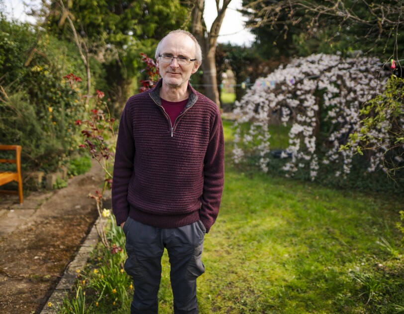 Portrait of Andrew Trehearne, who is taking part in UK Biobank's Long Covid research, in his garden