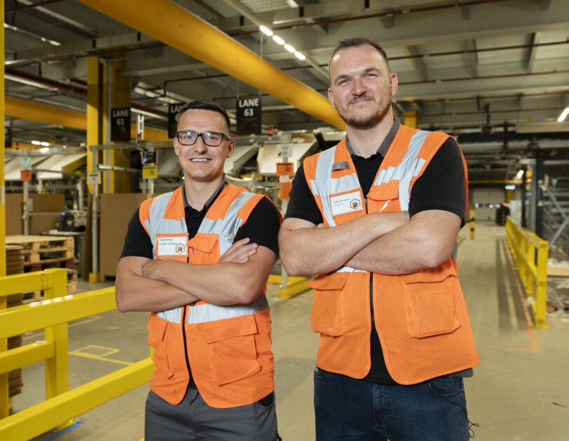 Military veterans Phil Davenport and Joe Haggis in an Amazon fulfilment centre