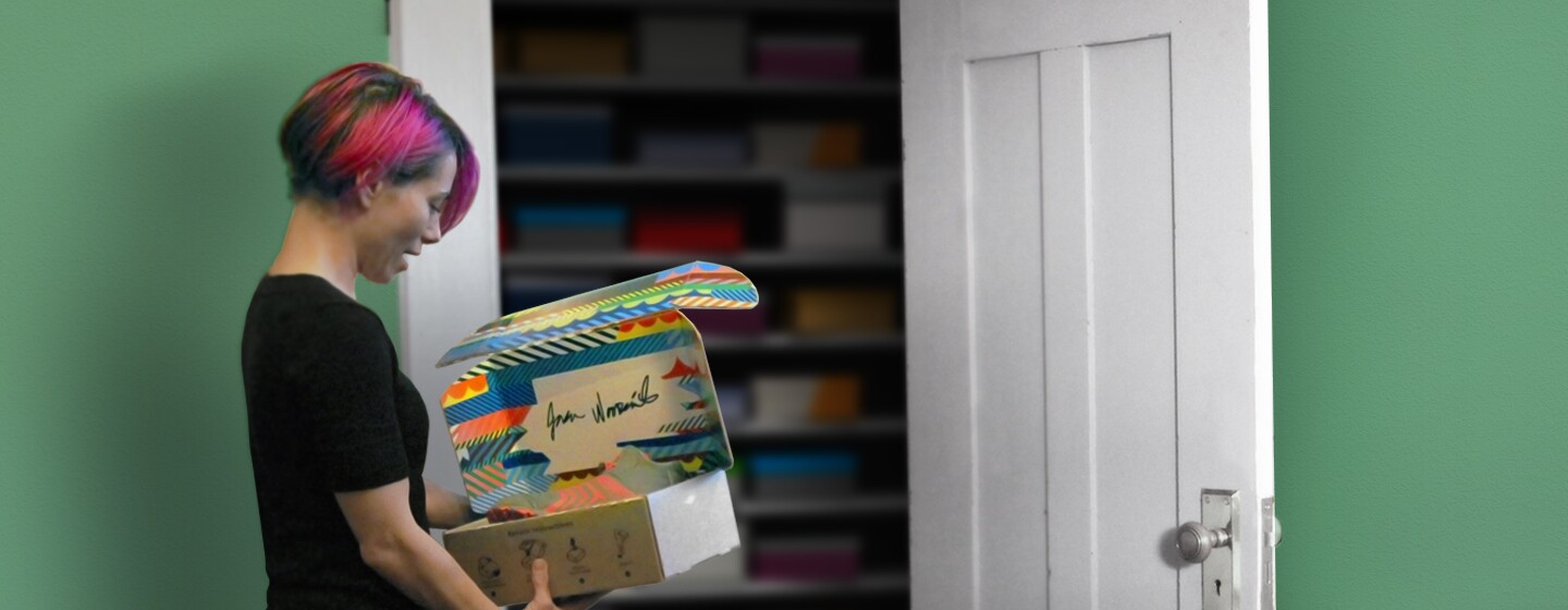 A woman holds an Amazon box designed to be reversible.