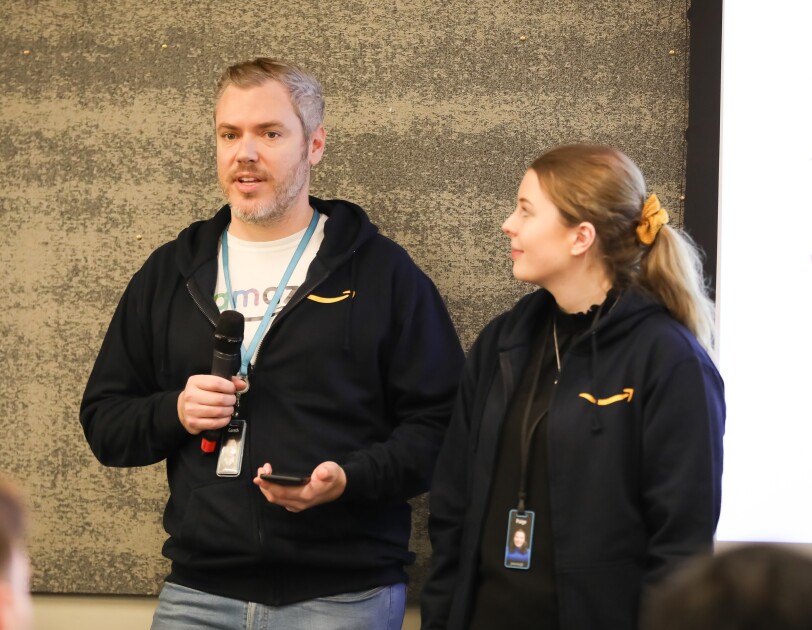 Gareth Johnson and Paige from glamazon giving a speech at the LGBT+ Leaders in STEM event.
