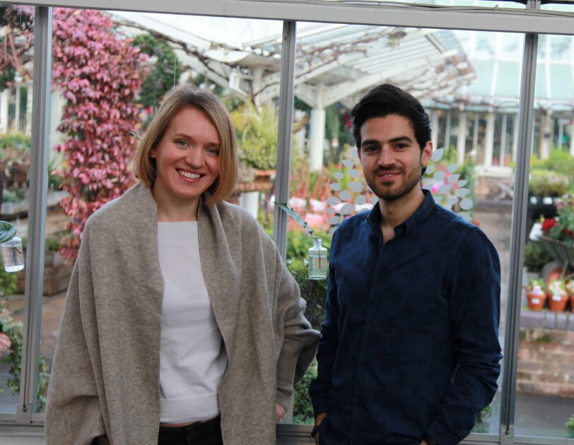 Nuki Health Co founders stood in front of floral background