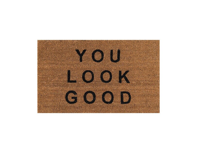 Coir door mat with "you look good" printed across the top.