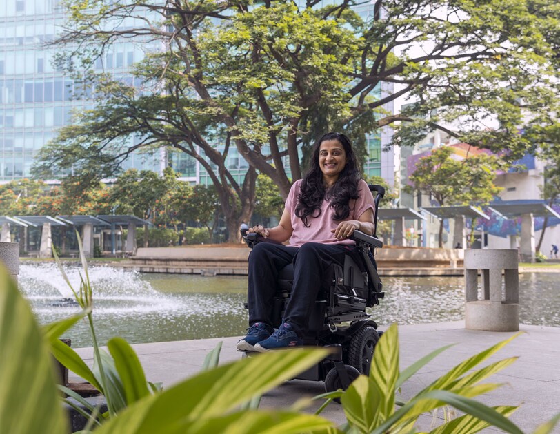 Mrunmaiy Abroal smiles for a photo in front of the Amazon building in Bangalore, India.