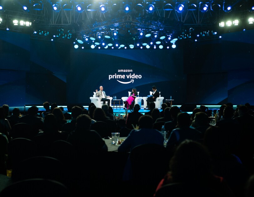 Jeff Bezos sits on stage with Bollywood star Shah Rukh Khan and director Zoya Akhtar during Prime Video in India update and announcement.