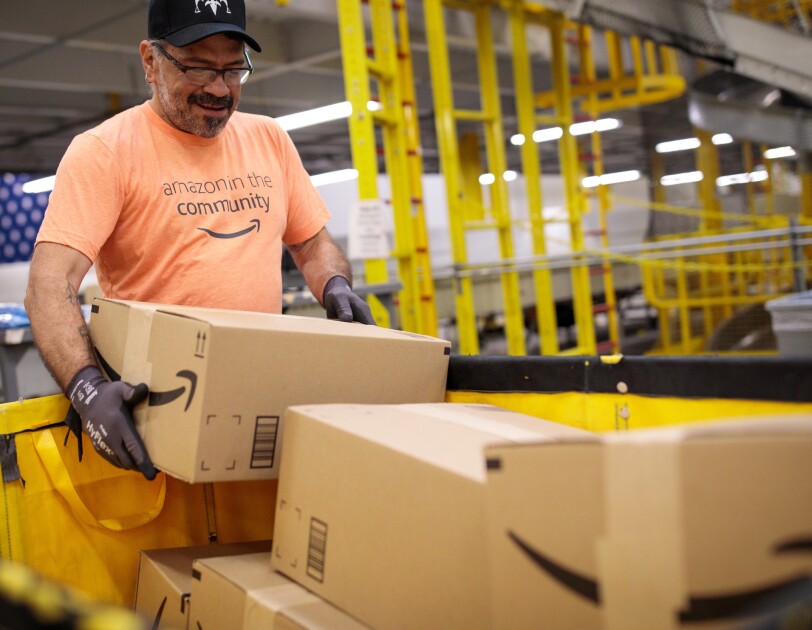 Amazon associates prepare items to distribute in the aftermath of Hurricane Dorian.