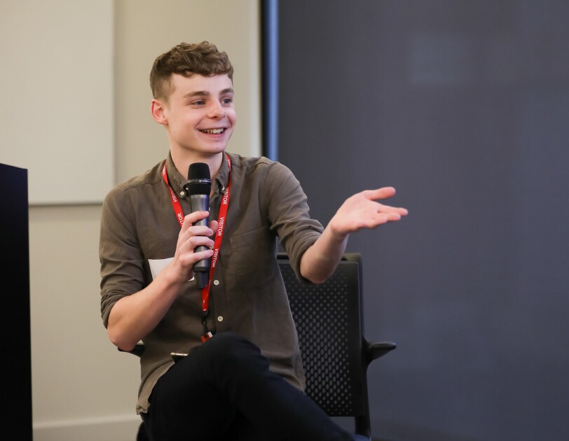 A shot of Jamie Brown, an engineer at the Financial Times, chairing a panel at Glamazon's LGBT leaders in STEM event.