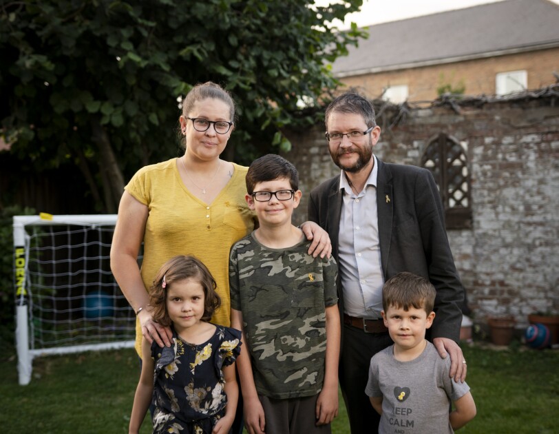 The Hay family, four people, with little Kayla and her brothers, in their garden