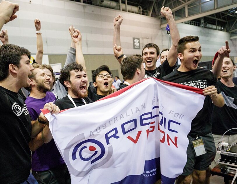 A group of Australian students cheer after winning the Amazon Robotics Challenge.