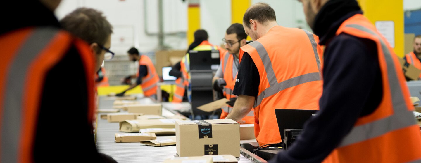 Amazon Fulfillment Center employees working