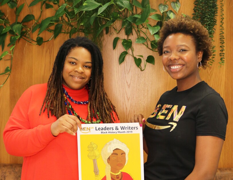 Amazon employee, Aisha Suleiman, holding artwork with artist Onyinye Iwu