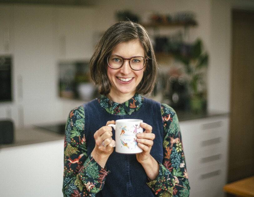 Bethan Thomas, co-founder of HotTea Mama, holding a mug of tea