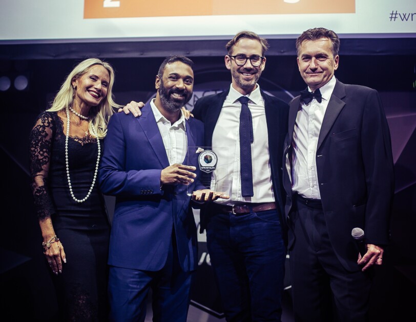 Matt from Universum and Amazon employees collecting award
