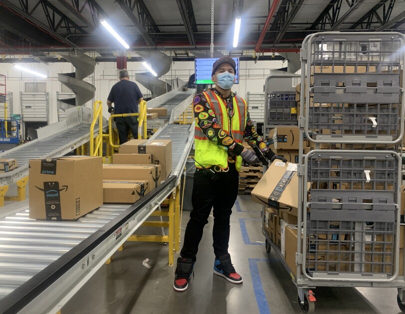 Anazon associate wearing a mask while working