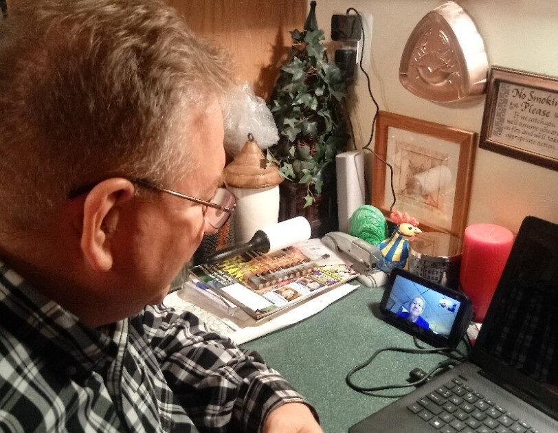 A man talks to his mom on an Echo Show device.