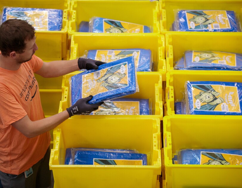 Amazon associates prepare items to distribute in the aftermath of Hurricane Dorian.