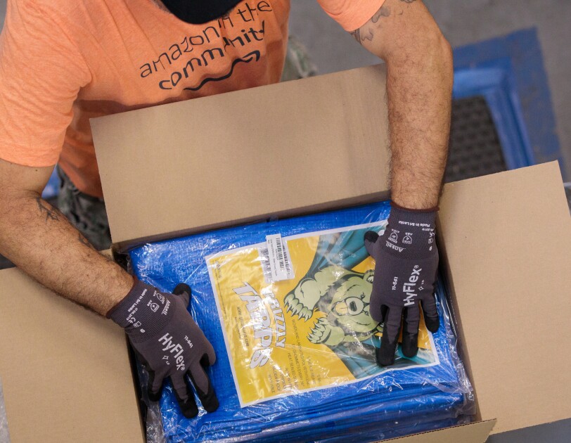 Amazon associates prepare items to distribute in the aftermath of Hurricane Dorian.