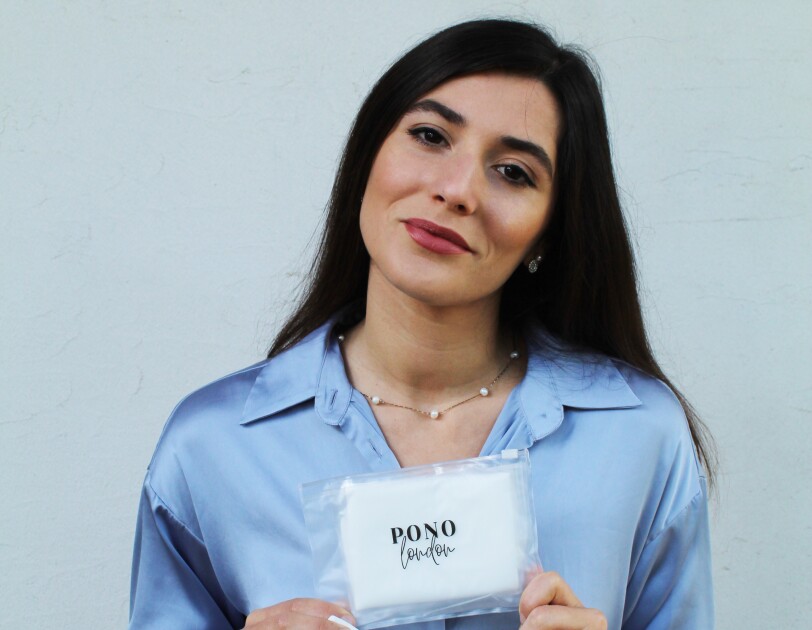 Mariana Santos, Founder of PONO London holding one of her products.
