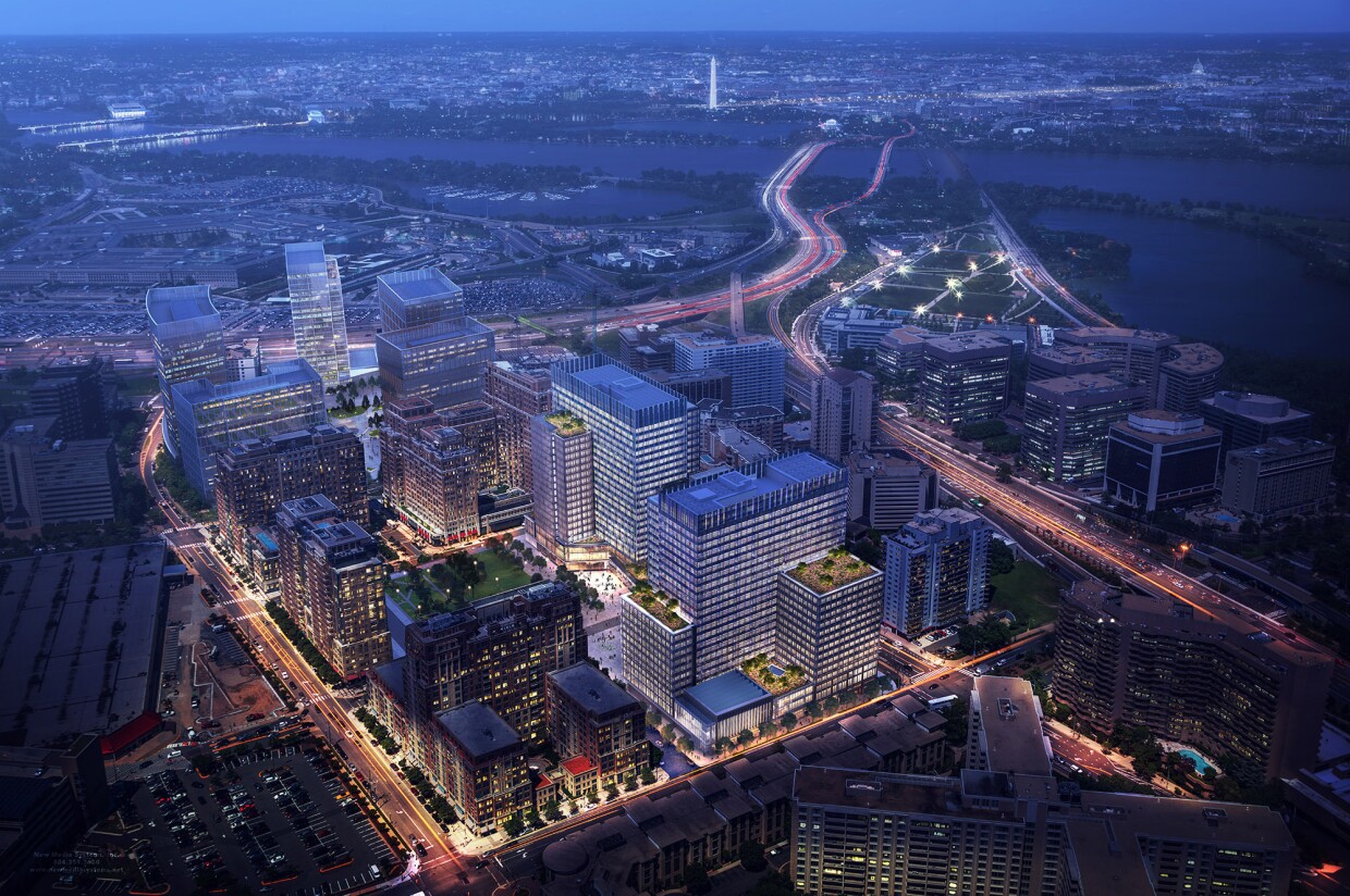 An image of Amazon's Arlington headquarters at night, showing rooftop building greenery.