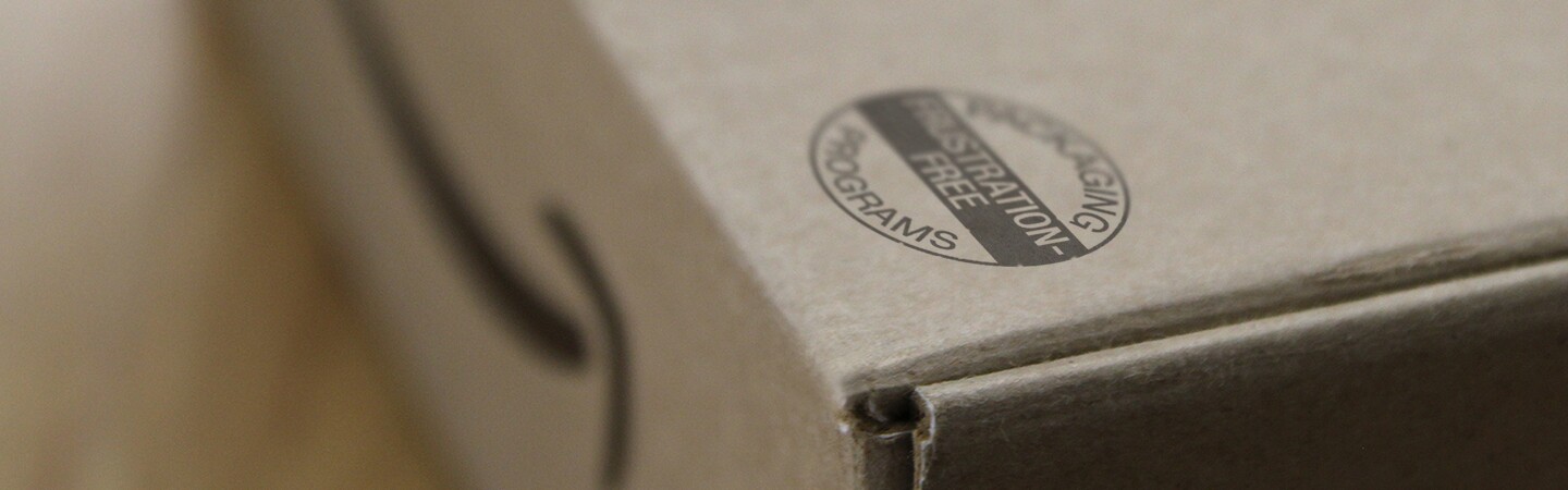 An Amazon box box with a seal that reads "Packaging Programs" "Frustration-Free".