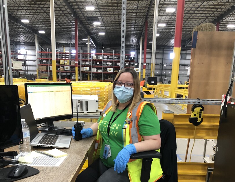 Anazon associate wearing a mask while working