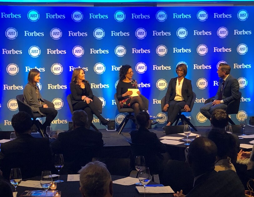 A panel at the JUST Capital awards dinner, featuring Amazon's Ardine WIlliams, alongside four other individuals.