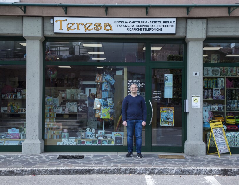 Andrea Locatelli, standing in front of the local shop "Teresa"