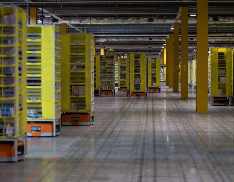 Robots working in the stow area of a fulfilment centre