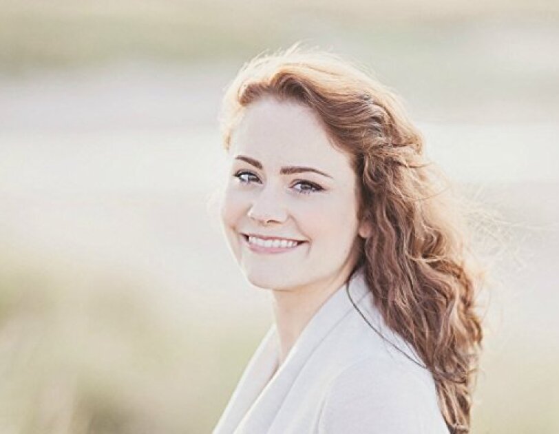 A portrait of Louise Ross smiling at the camera