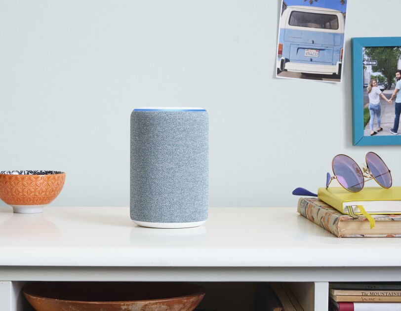 New Amazon Echo device in midnight blue on a console table. 