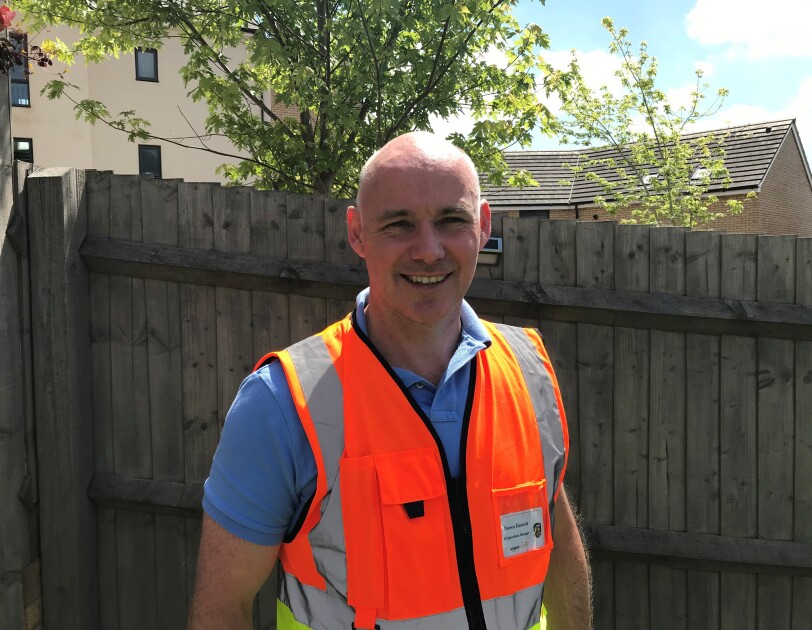 Headshot with PPE Darren Emmett
