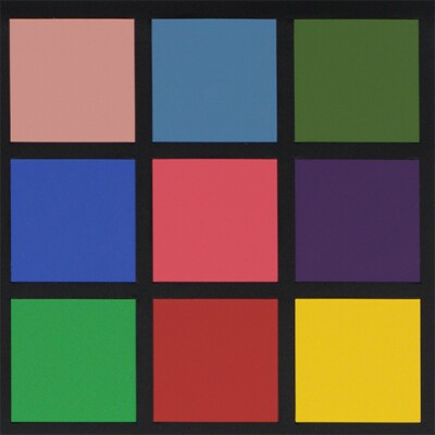 Squares of different colors are arranged in a three-by-three configuration. The colors are separated by black lines.