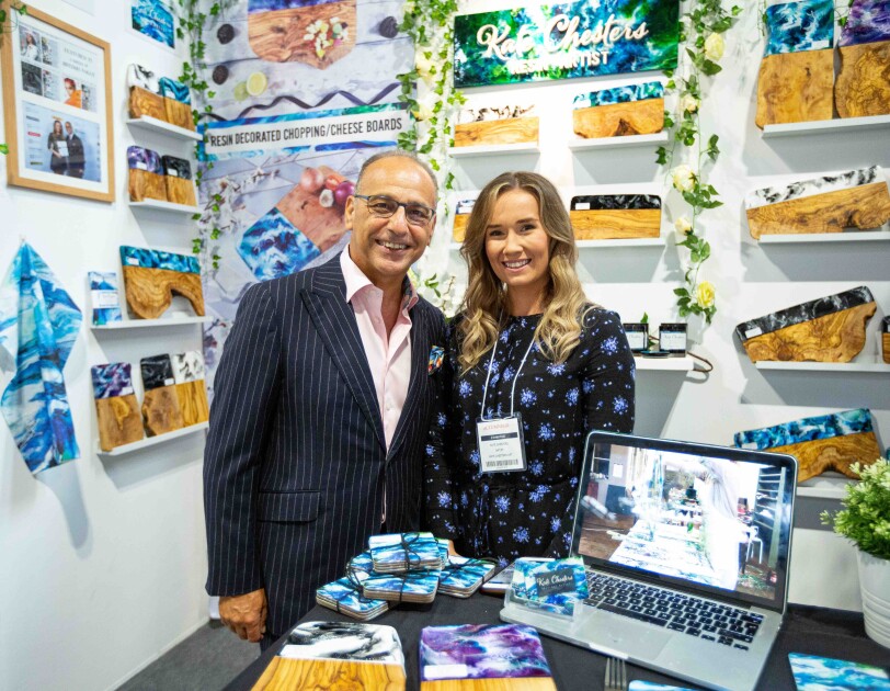 Kate Chesters and Theo Paphitis at her stand at the Autumn Fair, there are lots of Kate's products surrounding them.