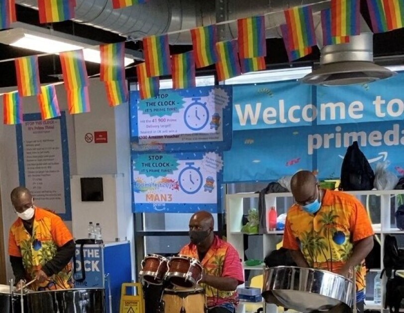 three men in a Calypso Band at amazon fulfilment centre in Bolton