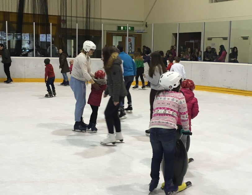 Amazon in the community takes refugees ice skating