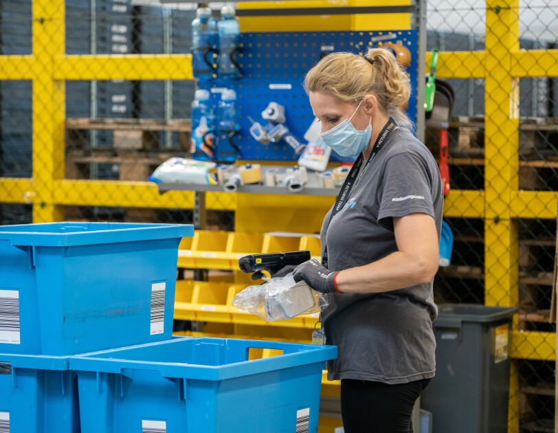 amazon employee in fulfilment centre carries out liquidation