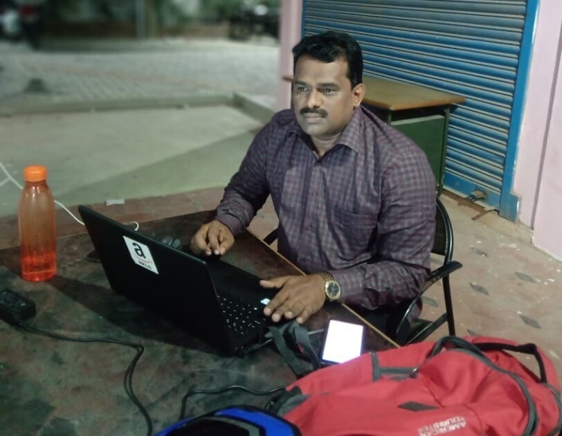 A service partner working on his laptop