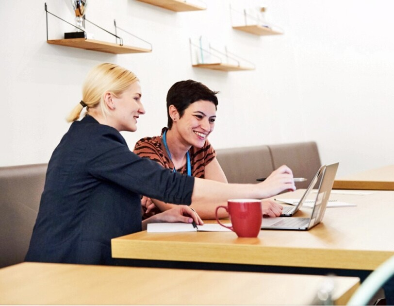 Amazon female employees having a discussion about ideas