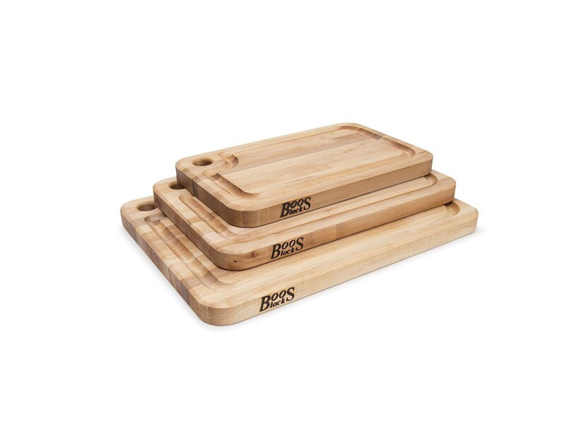 Stack of three Boos Block cutting boards on a white background