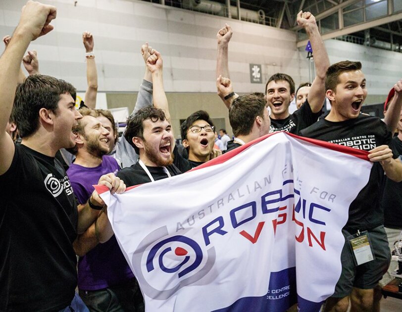 A group of Australian students cheer after winning the Amazon Robotics Challenge.