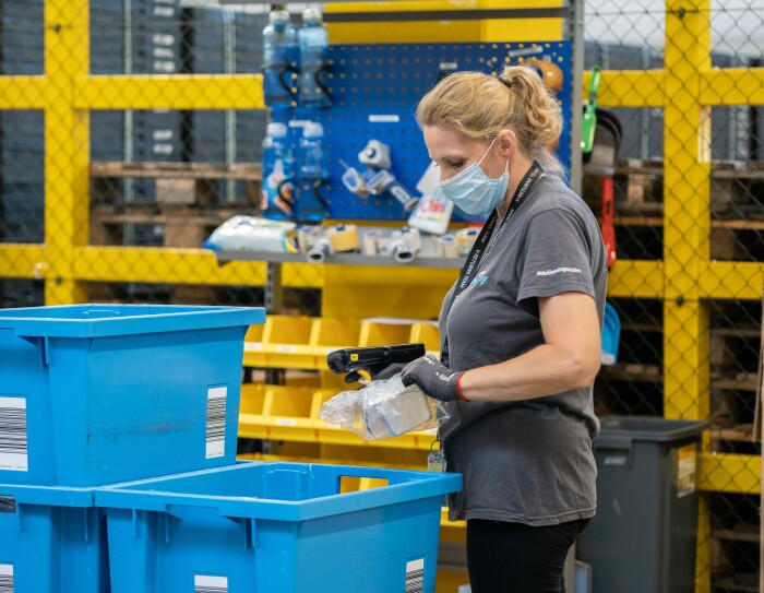 amazon employee in fulfilment centre carries out liquidation