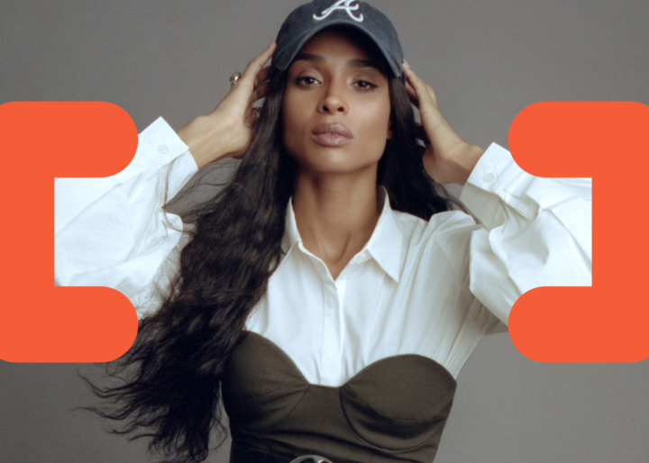 Singer/songwriter, Ciara, poses while coding symbols are overlaying the image.