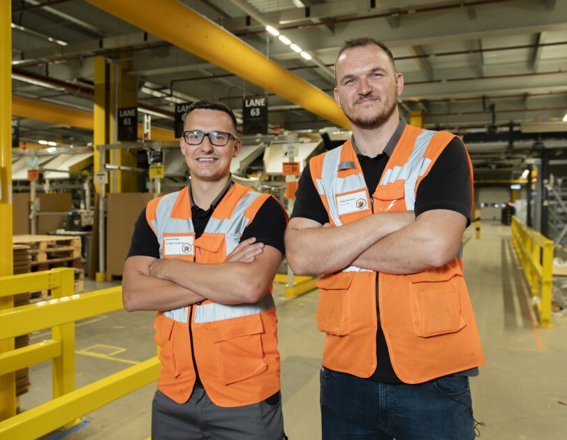 Military veterans Phil Davenport and Joe Haggis in an Amazon fulfilment centre